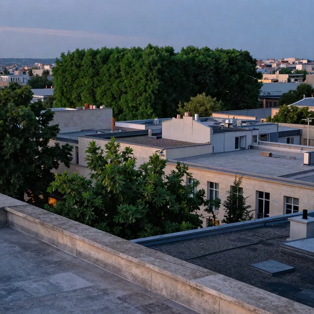 Rooftop view of urban canopy gaps and a dense restored green block at blue hour.